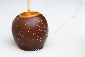 Dark chocolate and caramel covered green apple with sea salt