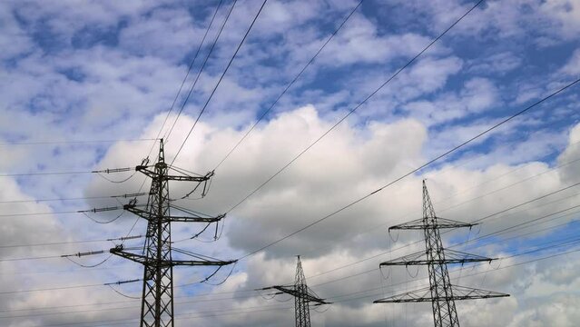 high voltage lines in front of clouds 4k 30fps time lapse video