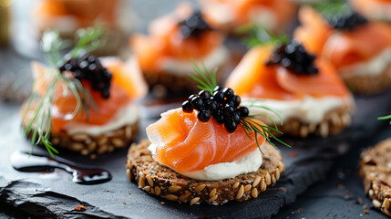 Indulge in gourmet party food with cocktail canapés featuring smoked salmon, cream cheese, and caviar elegantly arranged on rye bread.  - obrazy, fototapety, plakaty