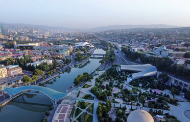 Amazing Drone panorama of Tbilisi with Rike park, bridge of Peace and Kura river and Public Service Hall- House of Justice © Marat Lala