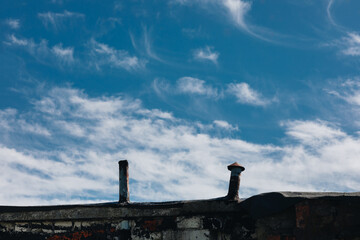 flat, old roof against the blue sky - 785711622