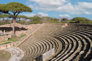 The Ancient Roman theatre in Ostia Antica. Latium, Italy - obrazy, fototapety, plakaty
