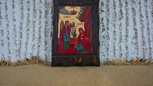 Christian orthodox icon of  the Annunciation to the Blessed Virgin Mary close up. Zoom out video.