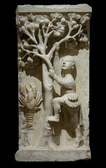 Fruit picking (Gemini climbing pear tree) and Cancer - high relief from Ferrara cathedral by...