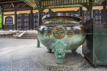 A huge incense burner at Kyoto Temple, Japan. 
The kanji says 'Fragrant Incense'.
