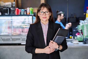 Portrait of business woman, accountant, lawyer, coffee shop cafeteria restaurant owner