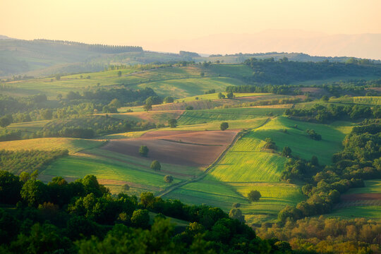 Magical green lands in Greece at sunset time.