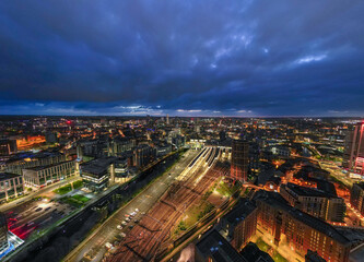This image stunningly portrays the city of Leeds at twilight, with the streets and buildings...
