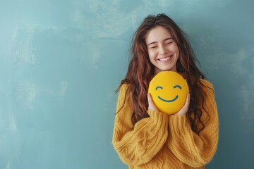 Happy woman hugging a smiley face cushion