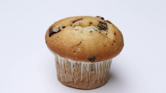 Muffin twist. Camera rotates around muffin cake. 4K Stop motion animation.