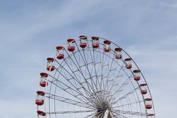 Big wheel against a cloudy blue sky