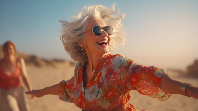 happy dancing mature woman at the beach.