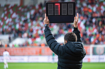 Obraz premium Technical referee shows added time during football match.