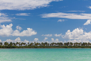 Turquoise Caribbean sea and blue sky with cloud, Saona