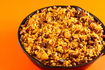 Baião de Dois traditional Brazilian food made with rice, beans, sausage and rennet cheese