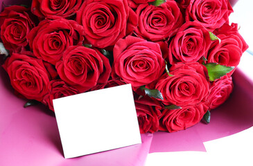 postcard layout. bouquet of red roses on a white background and space for text
