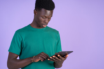 Man in Green Shirt Using Cell Phone