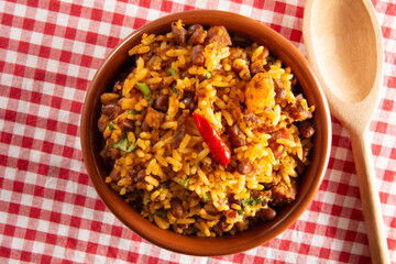 Baião de Dois traditional Brazilian food made with rice, beans, sausage and rennet cheese