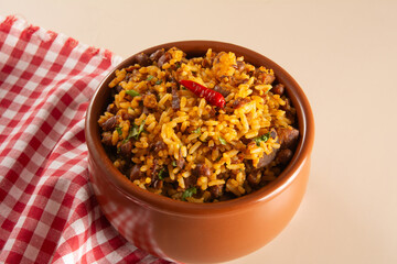 Baião de Dois traditional Brazilian food made with rice, beans, sausage and rennet cheese