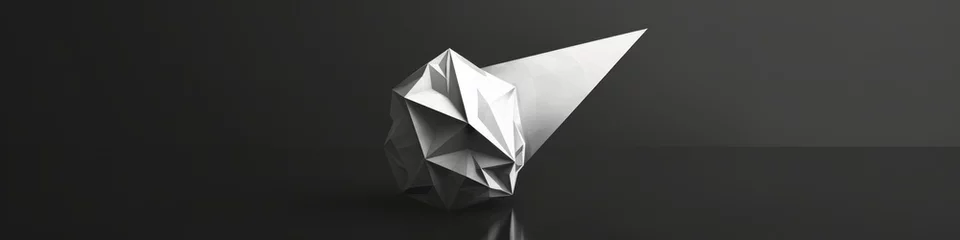 Store enrouleur tamisant sans perçage Montagnes Three-dimensional silver crumpled paper shape on black reflective surface under spotlight. Abstract form resembling a rumpled ball or mountain range, creating a dynamic and intriguing visual concept.