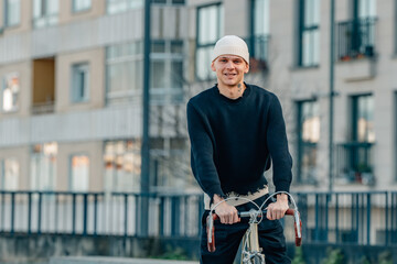 urban young man with bicycle on the street - 785744845