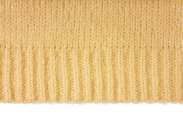 Yellow knitted woolen jersey fabric, sweater, pullover texture with edge isolated on white, transparent background. Fabric abstract backdrop, cloth wallpaper