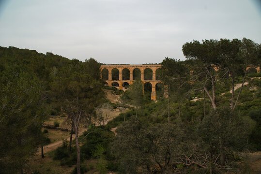 World Heritage Monument of the ancient Roman Empire, aqueduct that transported water to the city of Tarraco, Les Ferreres, also known as Pont del Diable. Tarragona, Spain photo taken on AP7 highway.