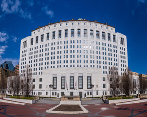 Wide angle panorama of the white marble entrance and facade to the Supreme Court of Ohio in Columbus with US flag flying