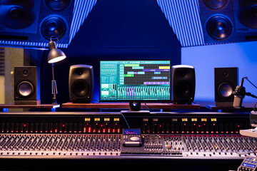 Empty professional studio used in music industry for producing tracks, mixing console and technical...