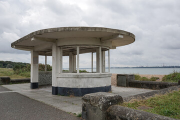 Old concrete weather shelter on coastal path. Ugly buildings 