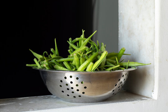 guar or cluster bean in a steel bowl plased at the window