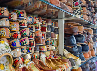 Traditional Rajasthan shoes of different colors in street markets.