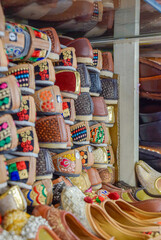 Traditional Rajasthan shoes of different colors in street markets.