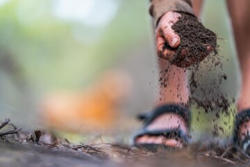 farmer hold soil in hands monitoring soil health on a farm.