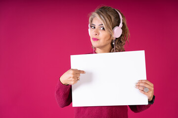 Woman Wearing Headphones Holding White Sign