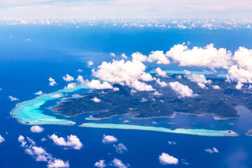 Bora Bora Island in Tahiti, French Polynesia. Travel, lifestyle, freedom and luxury concept. Aerial...