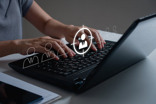 Target customer, Marketing plan and strategies. Customer Relationship Management, CRM. Businessman use laptop computer to focus target customer icon on virtual screen for customer centric strategies.