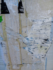 Abstract grunge background made of weathered and torn ads poster.