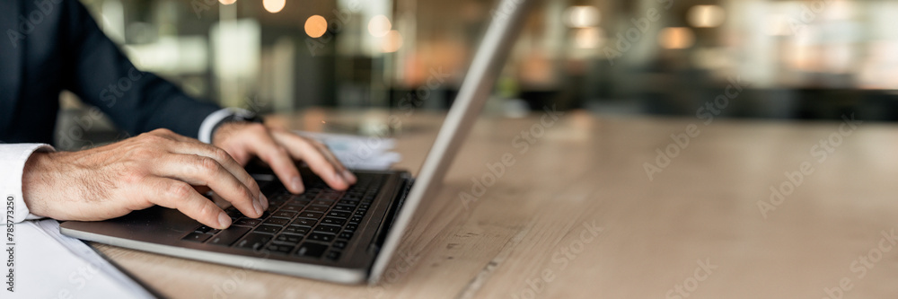 Poster closeup businessman using laptop, typing on keyboard