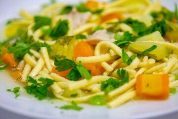 Healthy soup with chicken, vegetables and noodles.