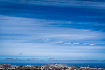 Landscape of the city of Las Palmas de Gran Canaria from the top of a mountain with horizontal clouds - obrazy, fototapety, plakaty