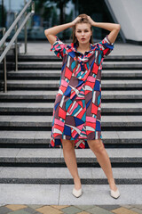 Obraz premium lady in colorful dress posing outdoors