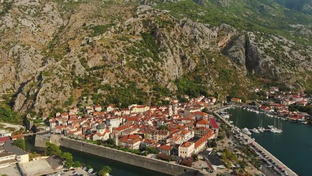 Aerial view of Kotor old city in Bay of Kotor, Boka Kotorska, Montenegro, tilt view, 4k