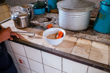 Deep dish containing spices that will be used to prepare a traditional Guatemalan dish.