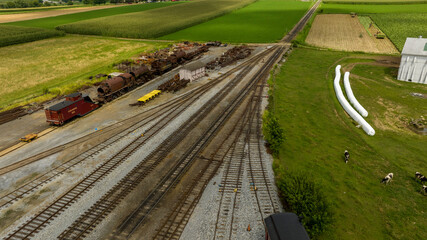 Rural Train Yard Amidst Agricultural Fields