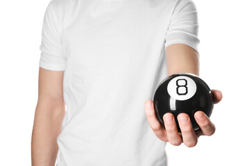 Man holding magic eight ball on white background, closeup