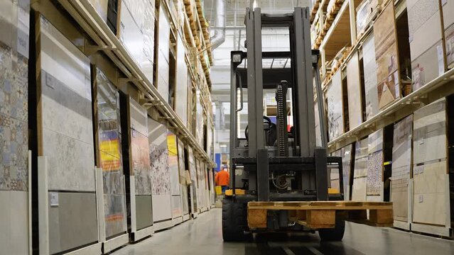 Forklift loader. Pallet stacker truck equipment in tile shop