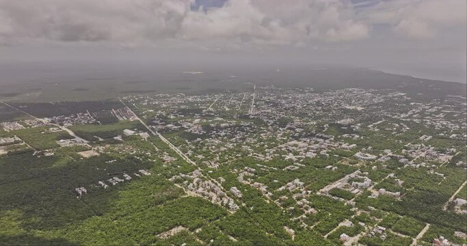 Tulum Mexico Aerial v8 high altitude drone flyover luxury neighborhood, panning views capturing resort town center, La Veleta and ocean views from above - Shot with Mavic 3 Pro Cine - July 2023