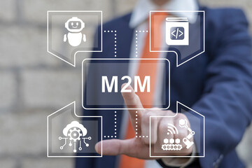 Business man using virtual touch screen presses abbreviation: M2M. M2M Machine-to-Machine Business Industry concept. Machine to Machine Smart Production Artificial Intelligence technology.
