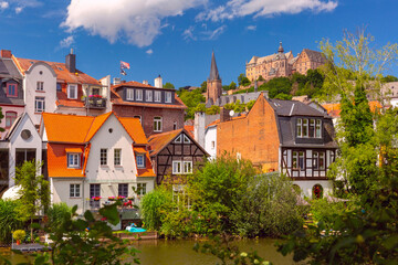 Marburg cityscape with the iconic castle perched above historical German buildings, Germany